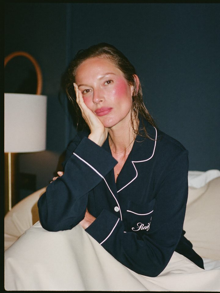 Fanning a flushed face in bed at night
