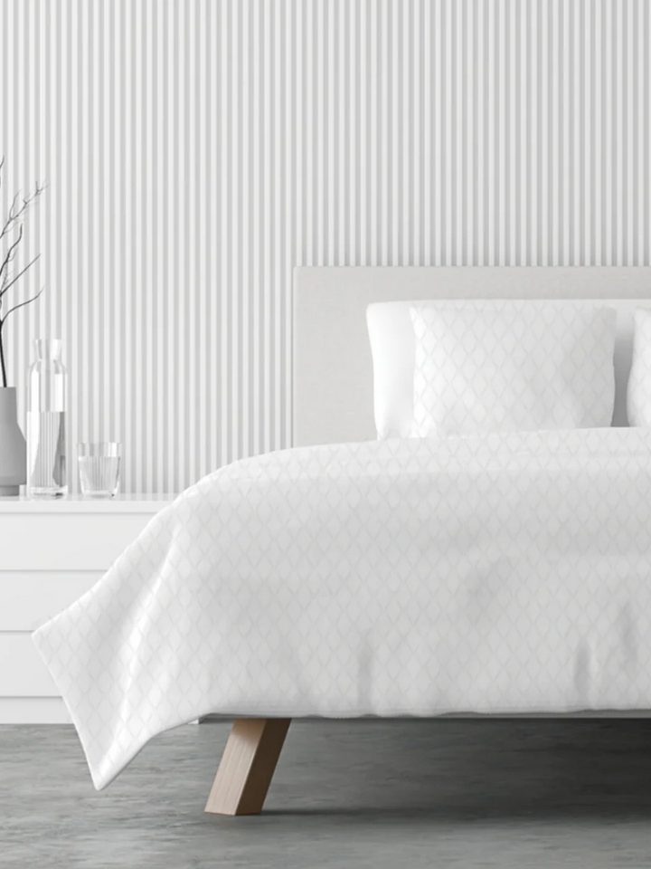 Lusome sheets in white on a bed